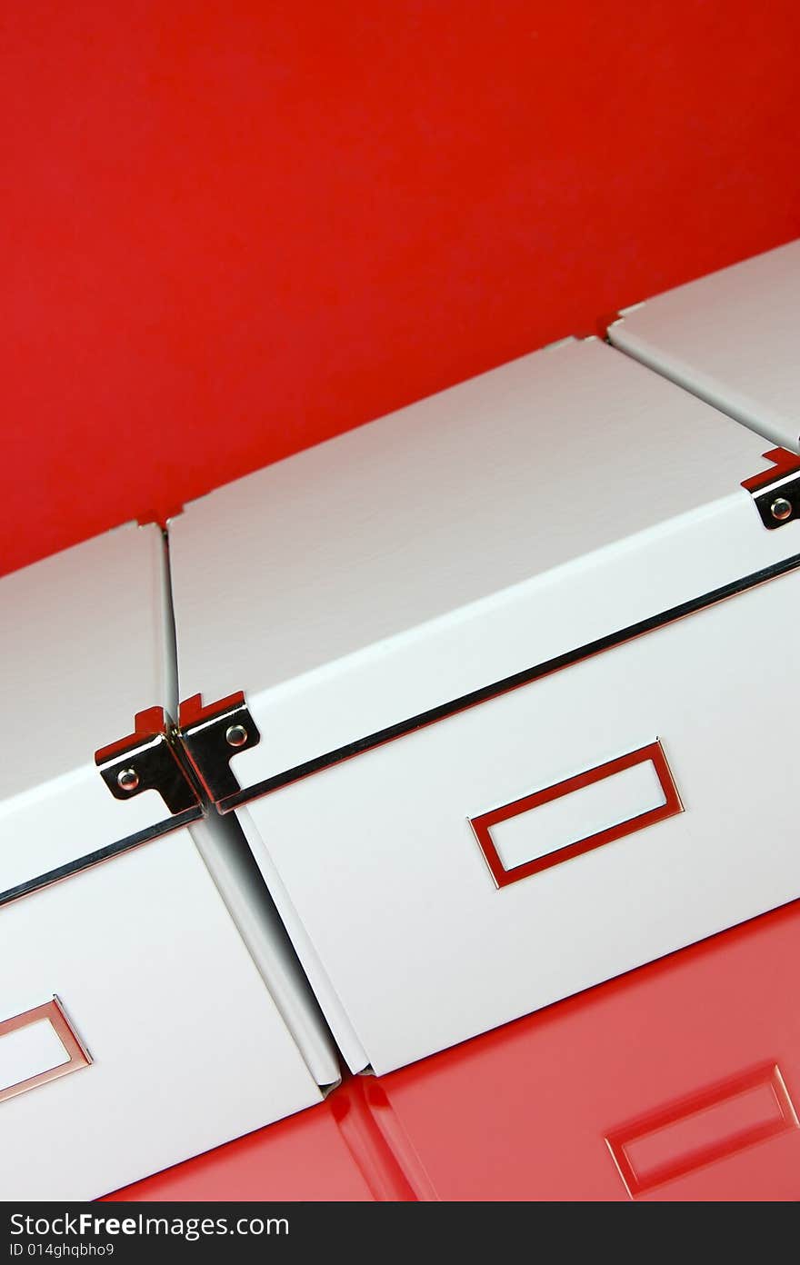 Storage boxes isolated against a red background