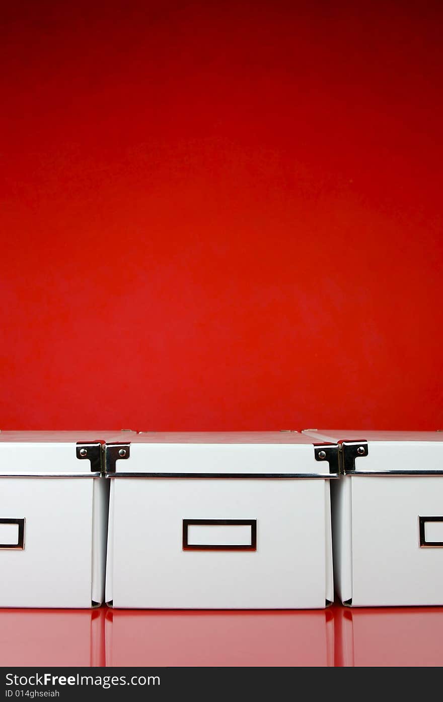 Storage boxes isolated against a red background