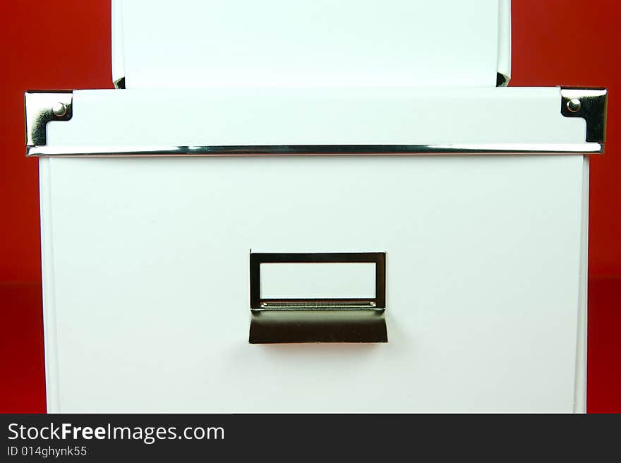 Storage boxes isolated against a red background