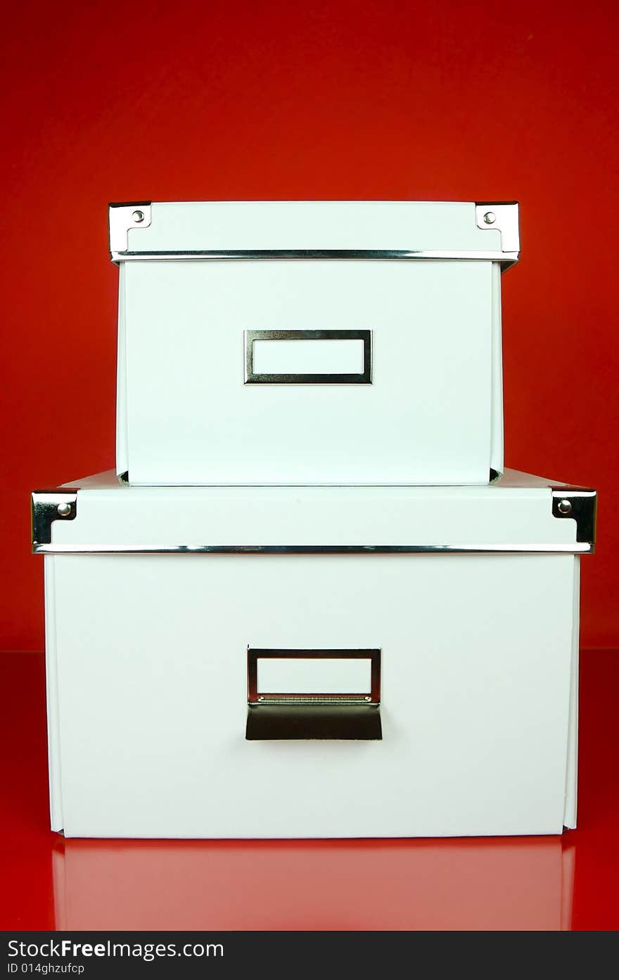 Storage boxes isolated against a red background