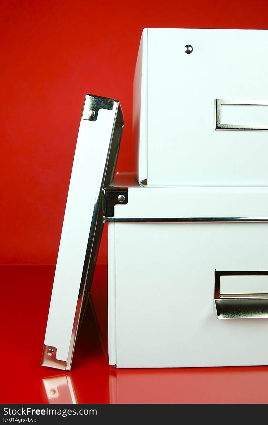 Storage boxes isolated against a red background