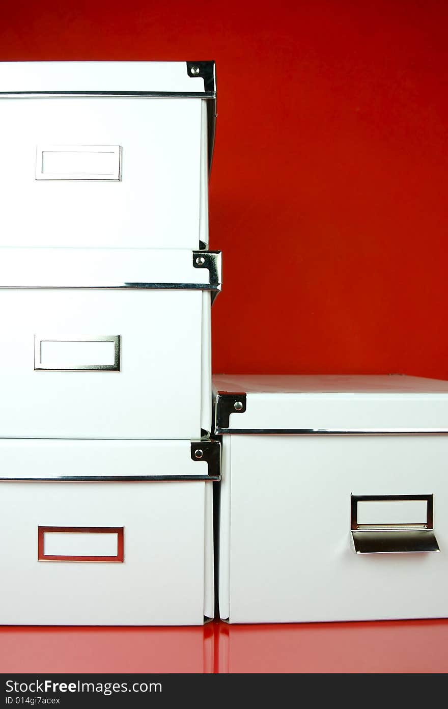 Storage boxes isolated against a red background