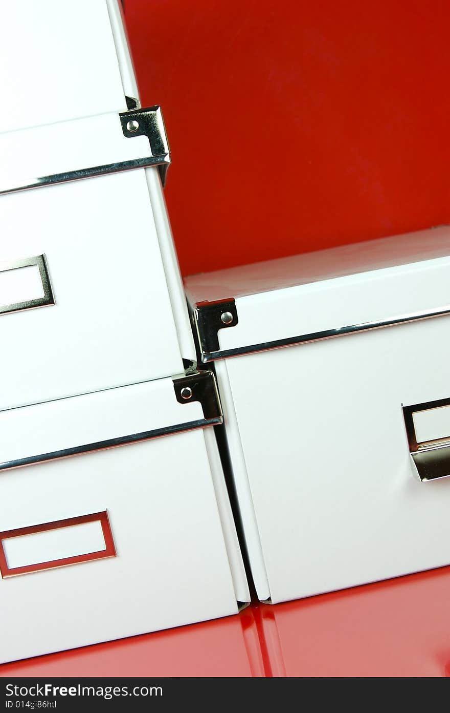 Storage boxes isolated against a red background