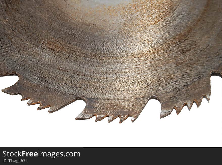 Part of a rusty circular saw blade isolated on white background