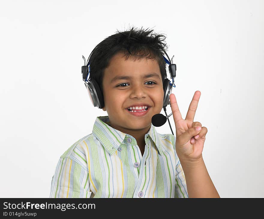 Boy with headphones victory sign