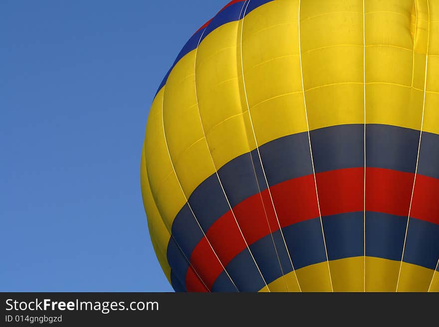 A red, yellow and blue hot air balloon at the annual Kannapolis, North Carolina Hot Air Balloon festival. A red, yellow and blue hot air balloon at the annual Kannapolis, North Carolina Hot Air Balloon festival