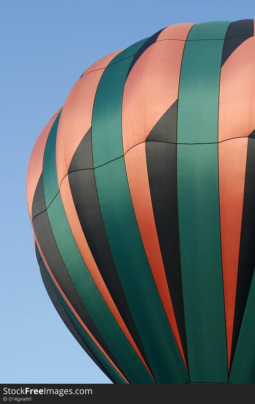 A pink, green and black hot air balloon at the annual Kannapolis, North Carolina Hot Air Balloon festival