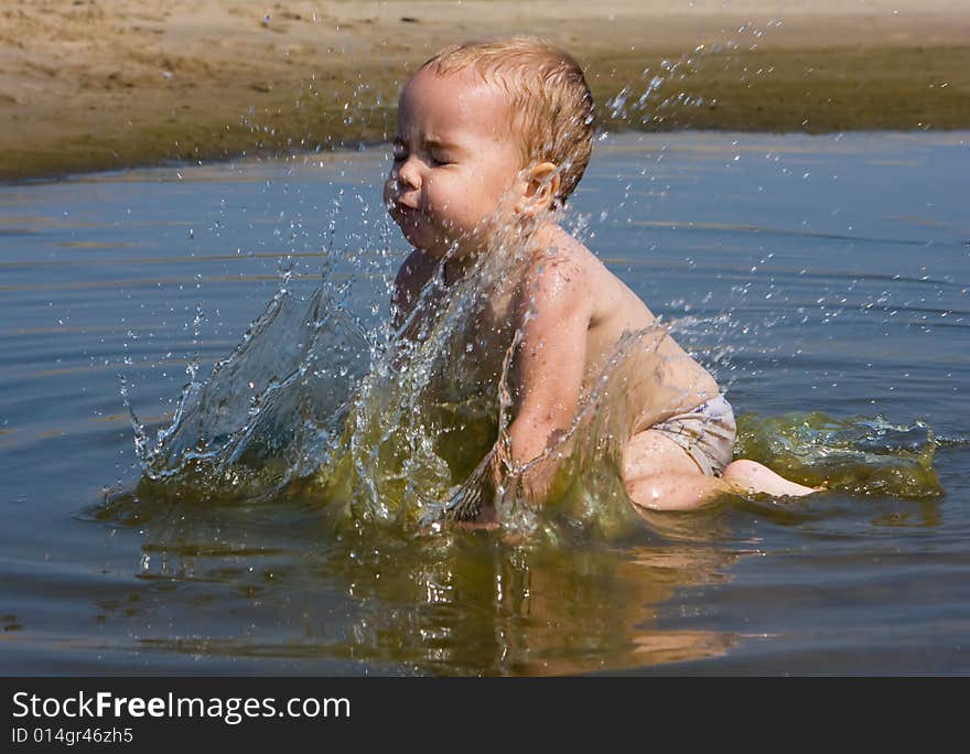 Cute little baby having fun at the sea. Cute little baby having fun at the sea