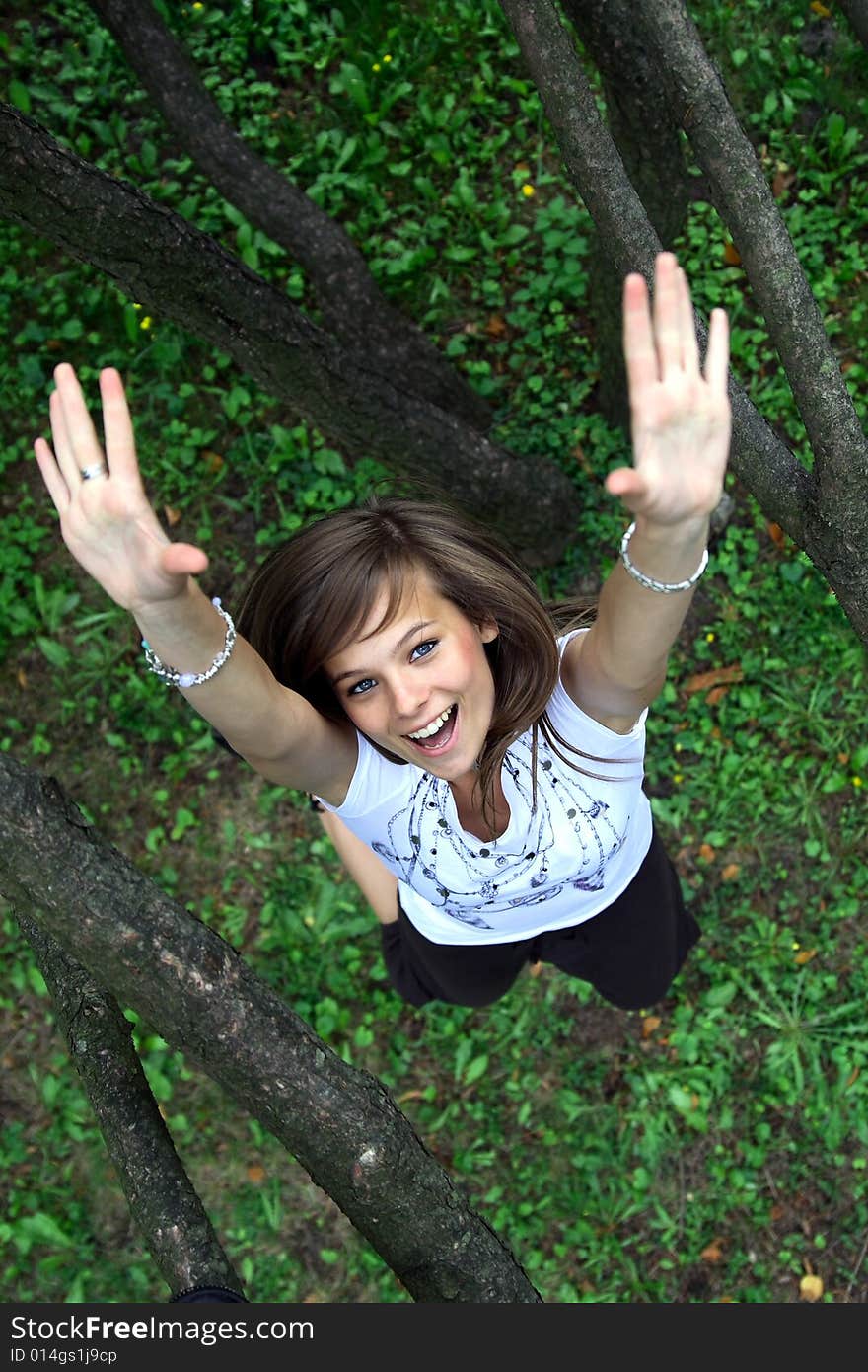 Young Pretty Girl Jumping To Touch The Camera