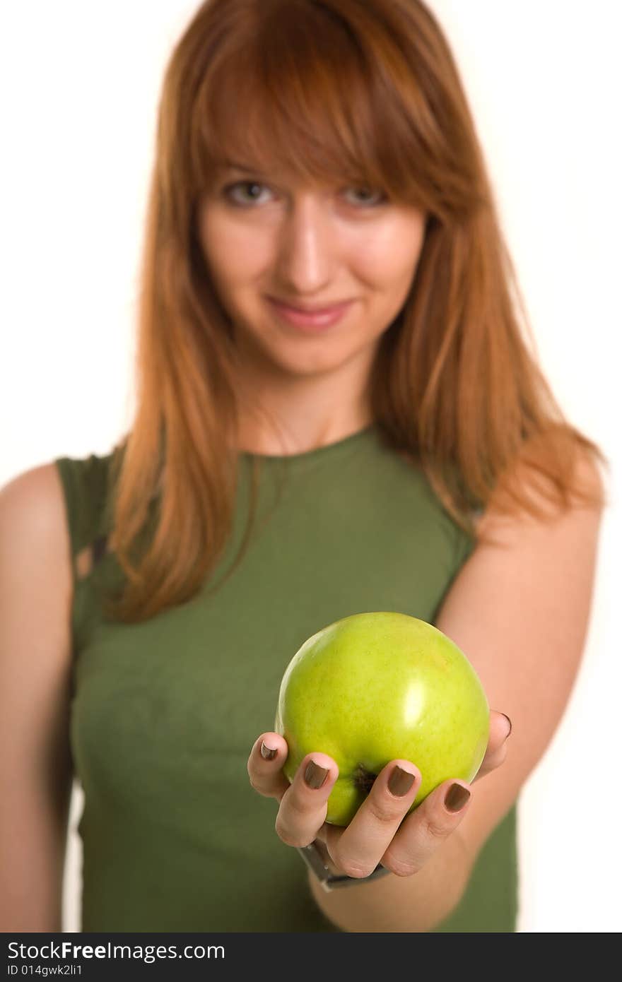 Fitness girl with green apple, focus on fruit, isolated on white background