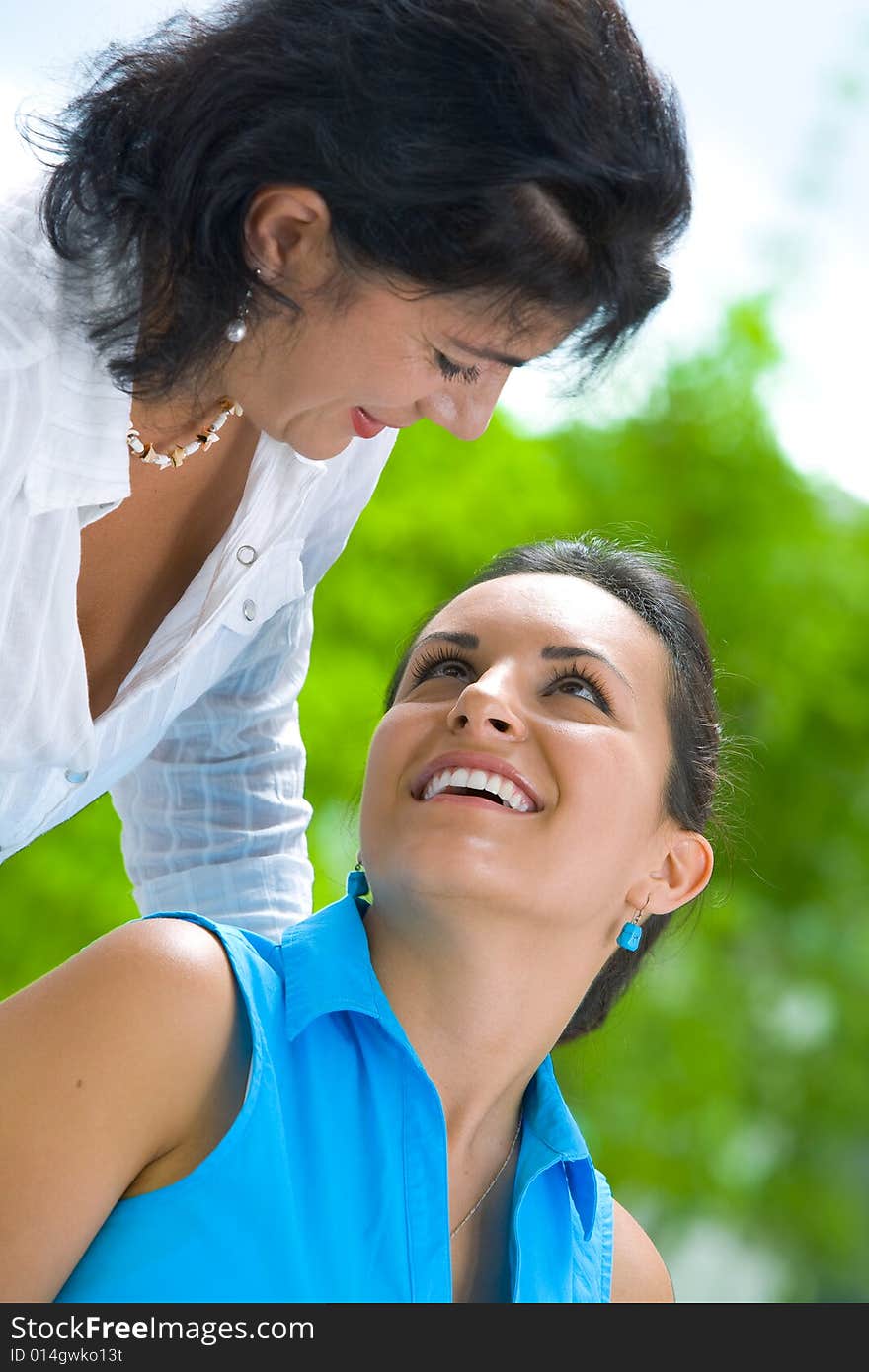 Portrait of  two beautiful women in summer environment. Portrait of  two beautiful women in summer environment