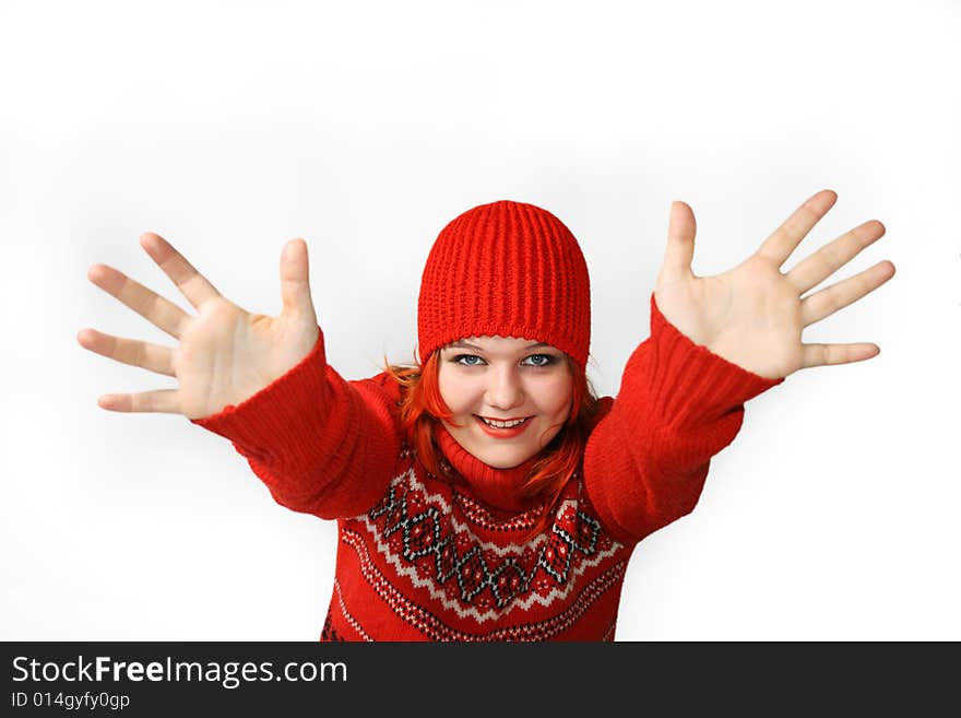 Happy girl with hands up in the red cap Against the white background.