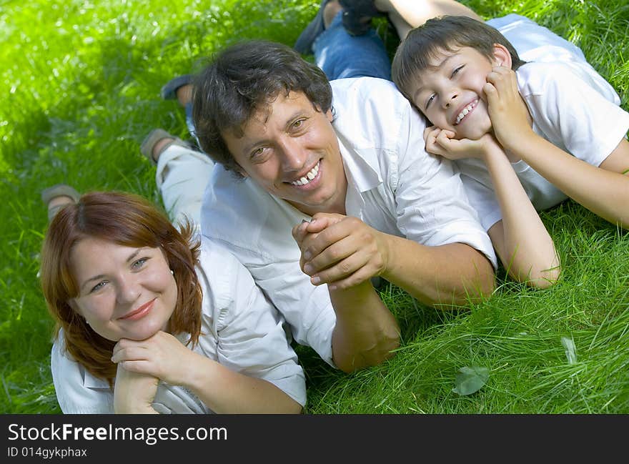 Portrait of young happy family in summer environment. Portrait of young happy family in summer environment