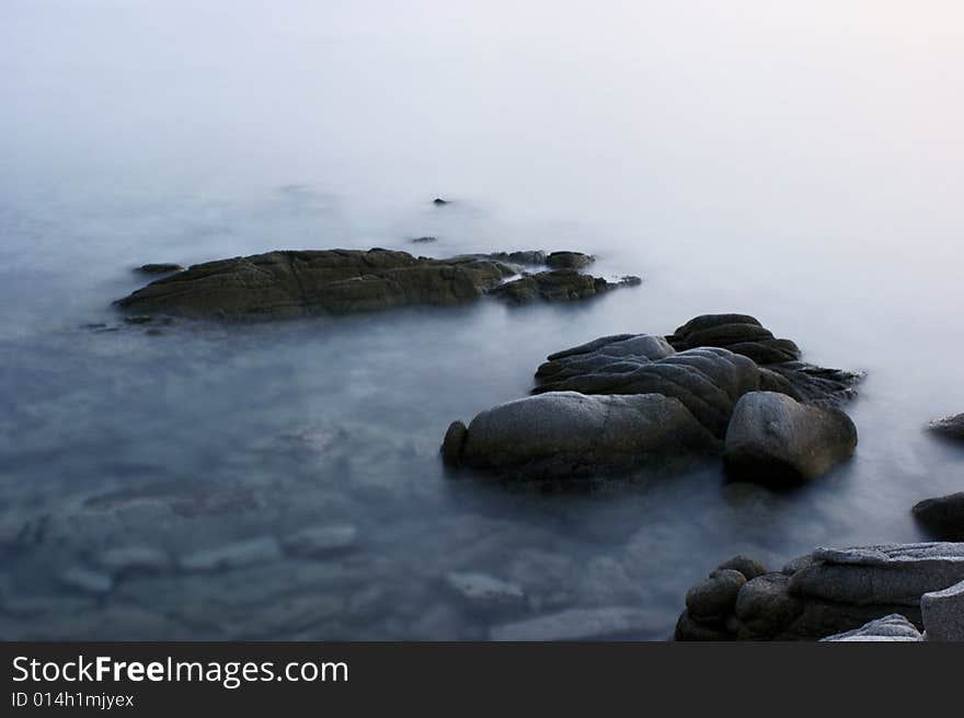 Rock in sea near city Toroni in Greece