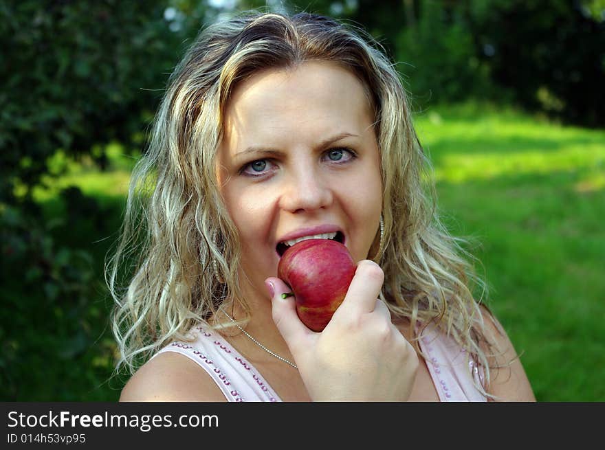 Woman eating apple