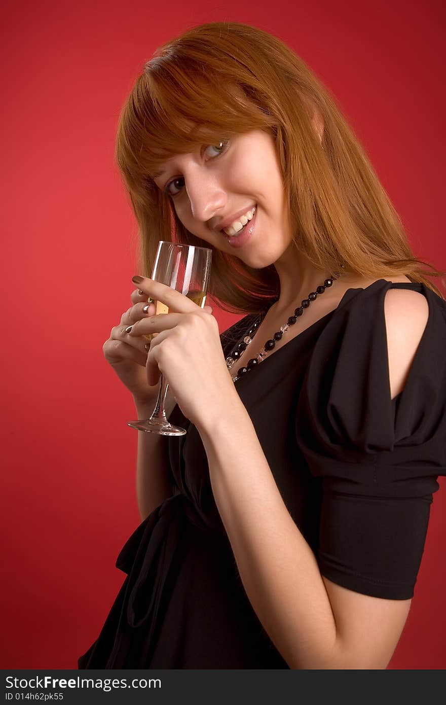 Sexy girl with champagne glass isolated on red background