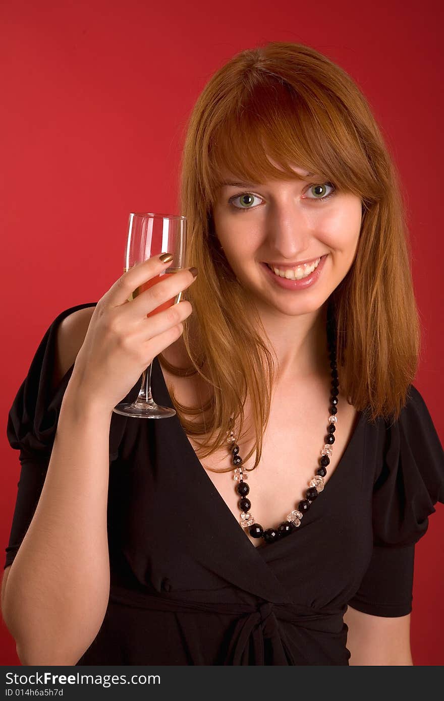 Beautiful girl with champagne glass isolated on red background