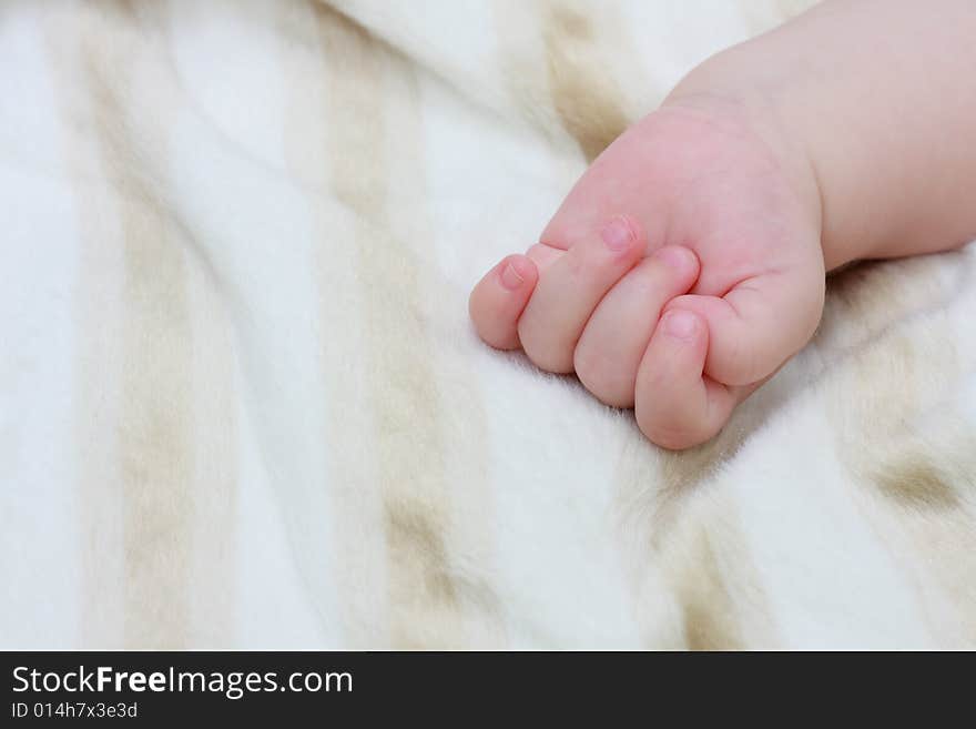 A closeup shot of baby showing details of her hand