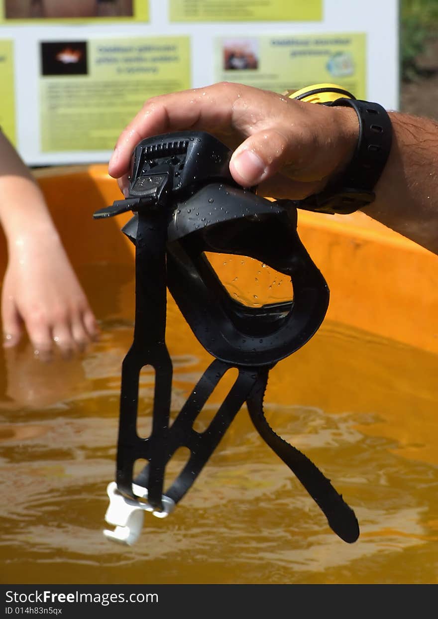 The rescuer-diver prepares for immersing in water. The rescuer-diver prepares for immersing in water