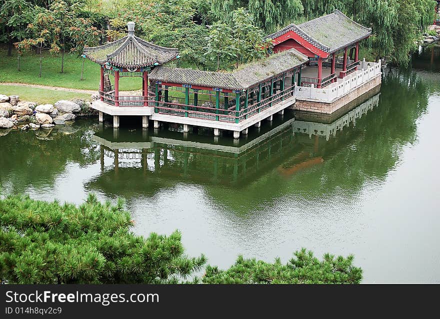 Beautiful pavilions beside the pond in a park. Beautiful pavilions beside the pond in a park.