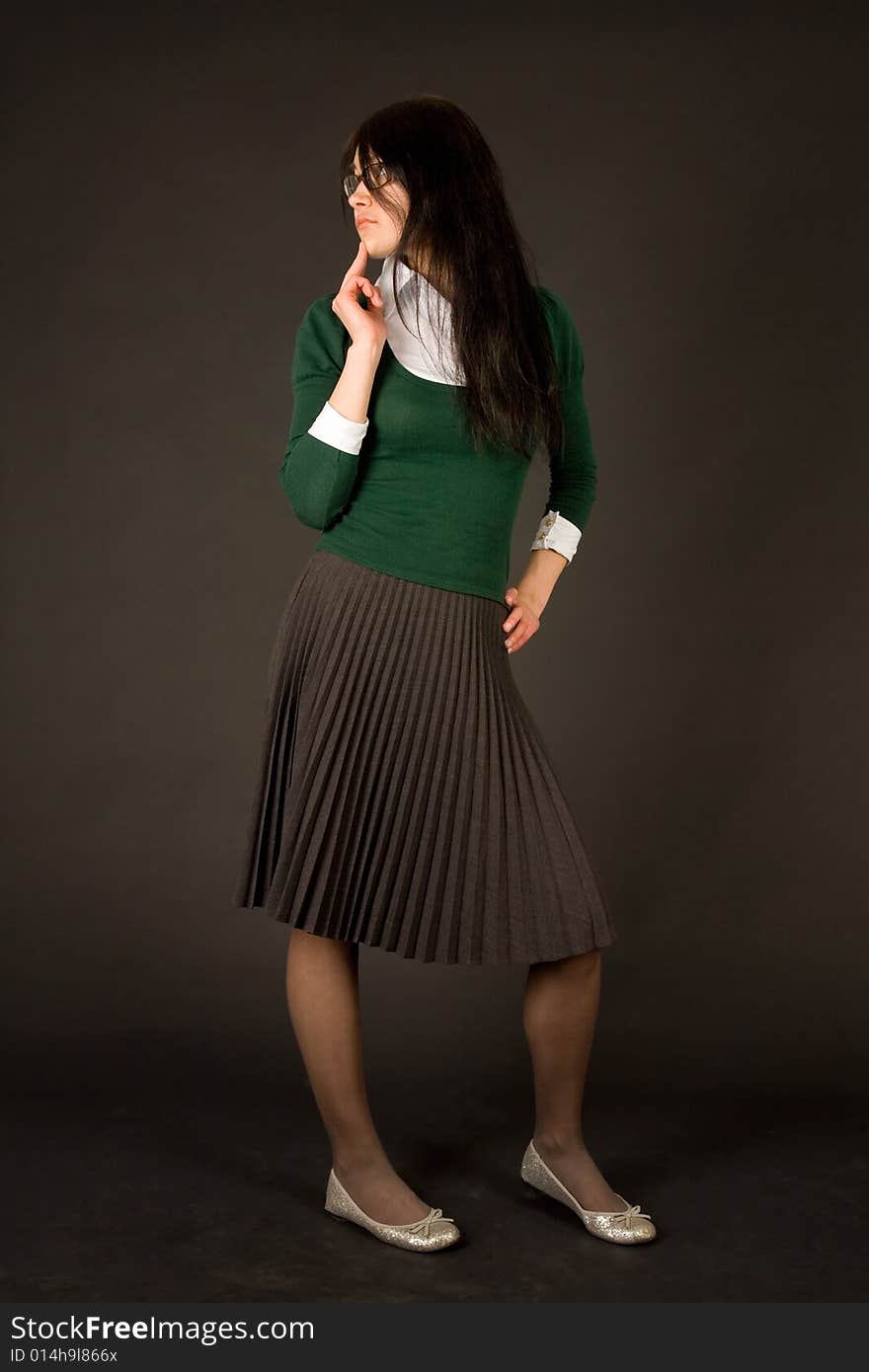 Young girl in business outfit isolated on black background