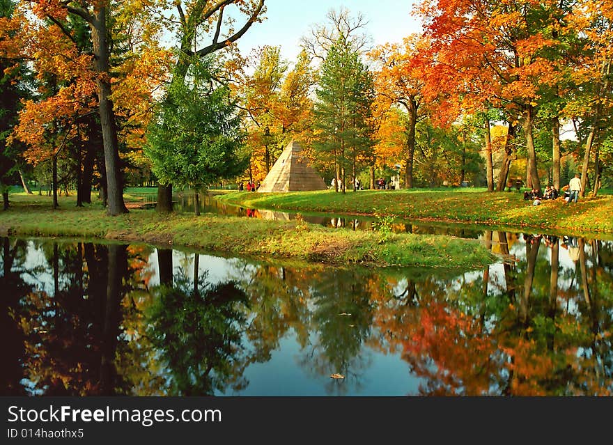 Autumn trees and pyramid