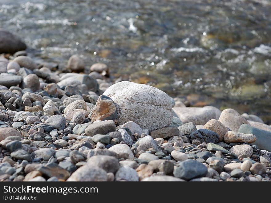 Stones on the bank of the mountain river. Stones on the bank of the mountain river