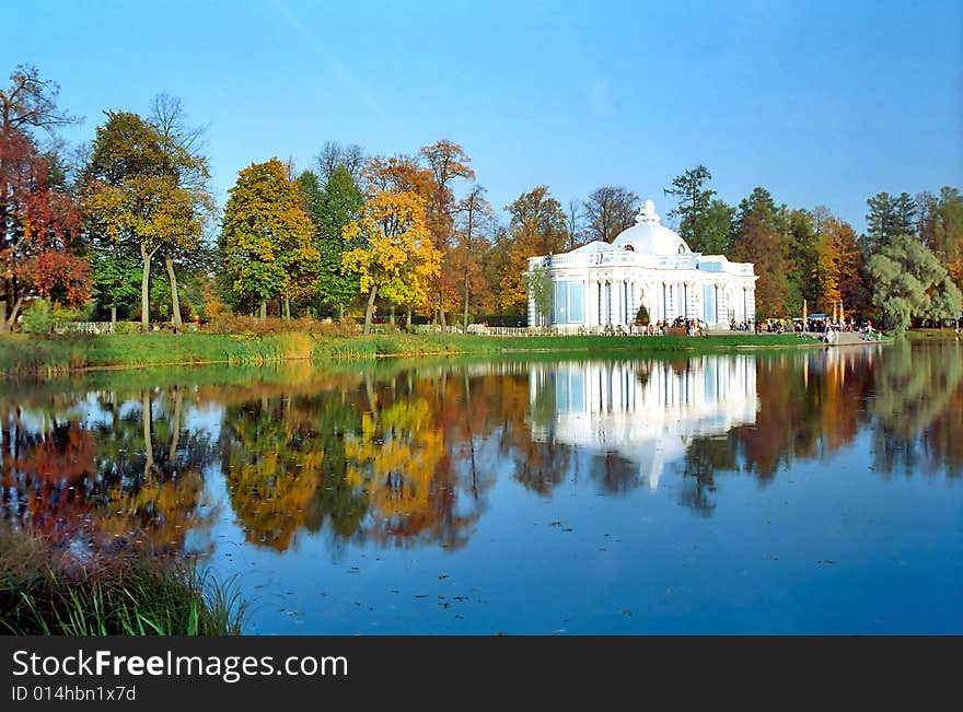 Classical building near the pond in autumn