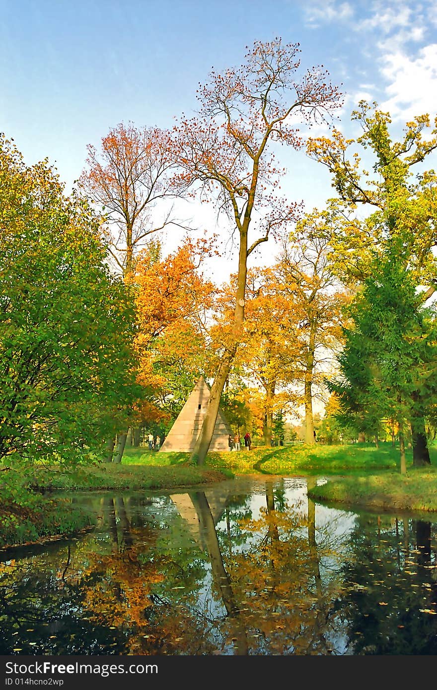 Autumn trees and their reflections in water. Autumn trees and their reflections in water