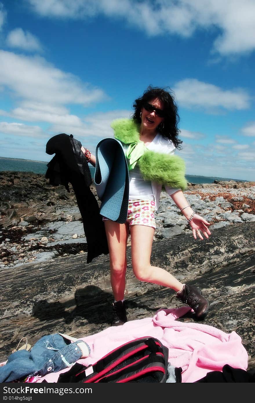 A woman ready to enjoy a day of freedom on the beach. A woman ready to enjoy a day of freedom on the beach