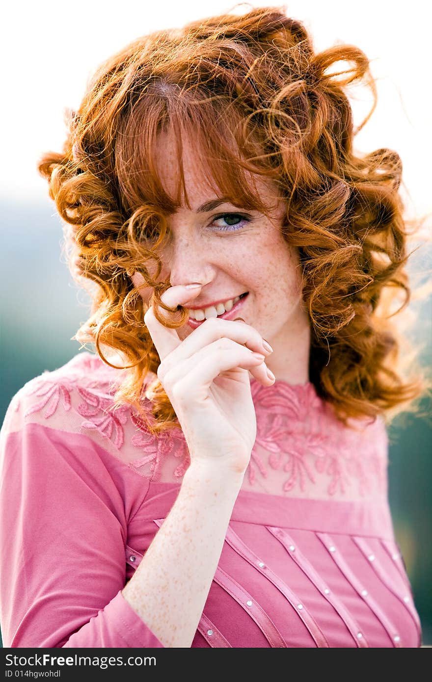 Close-up bright portrait of red-haired lovely young woman outdoors. Close-up bright portrait of red-haired lovely young woman outdoors