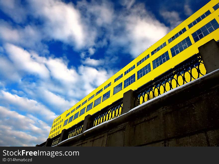 Photo of the main facade of yellow modern building. Photo of the main facade of yellow modern building