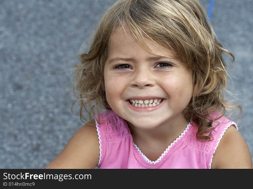 A picture of a cute little girl smiling. A picture of a cute little girl smiling