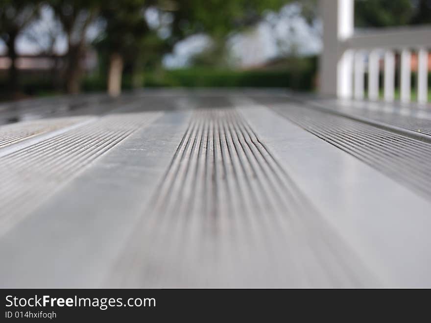 A metal park table with medium focus. A metal park table with medium focus