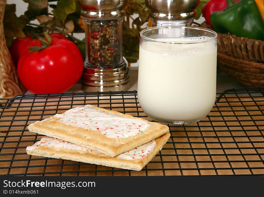 Toaster pastries and milk in kitchen. Toaster pastries and milk in kitchen.