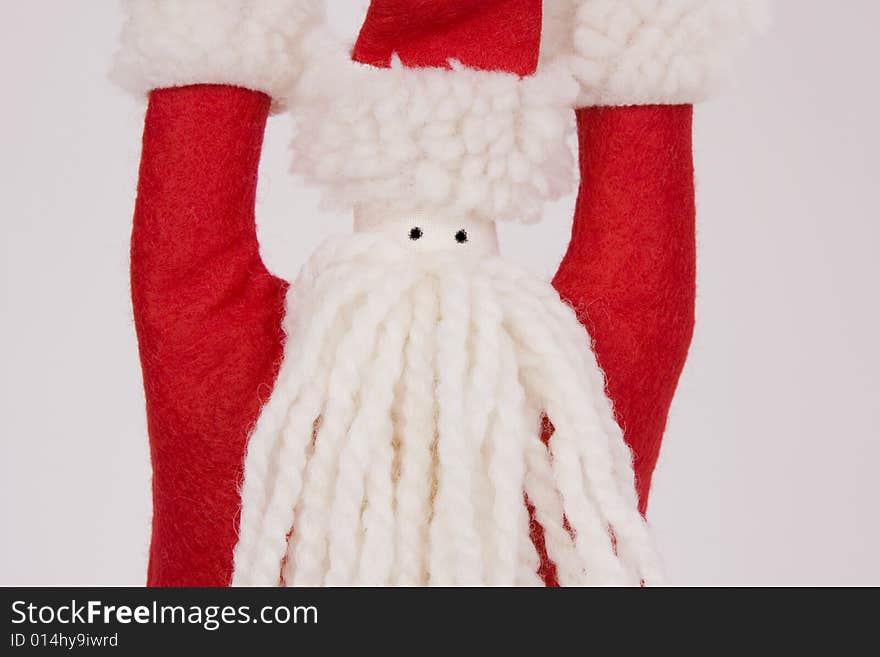 A yarn and felt hand crafted Santa Claus.