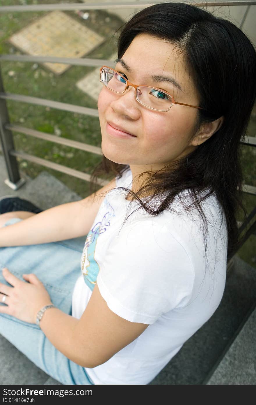 Young lady sitting at stair