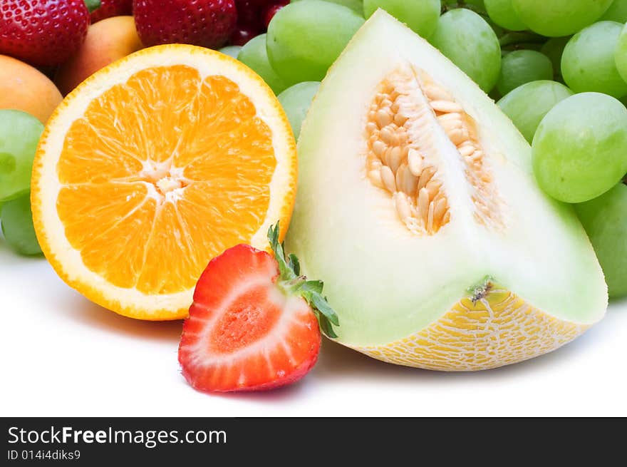 Slice fresh fruits on white background