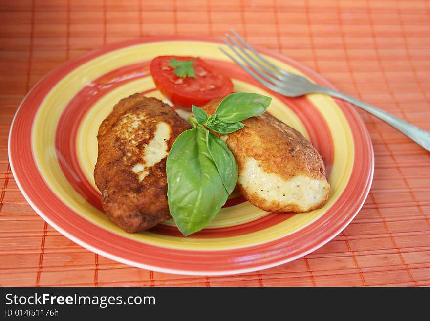 Juicy pork chops with a garnish from greens.