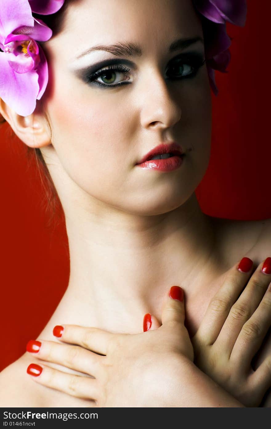 Beauty portrait of a young beautiful woman with flowers