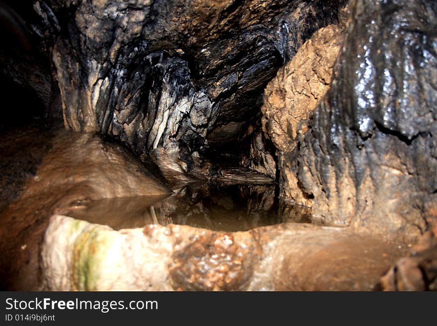 The cave with stalactites and underground lake