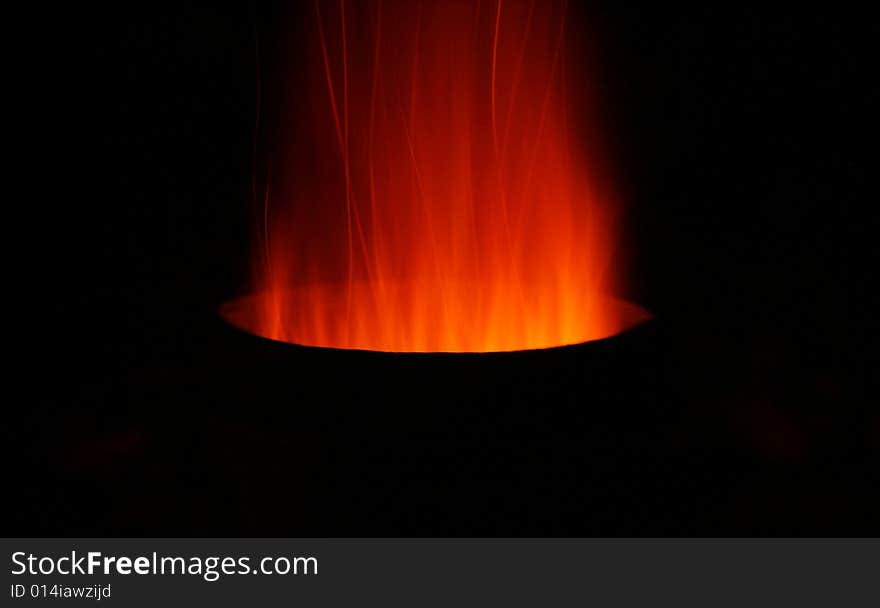 Sparks and fire coming out of the top of a chiminea