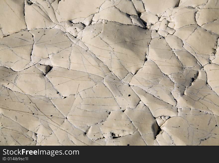 An old natural stone texture with cracks