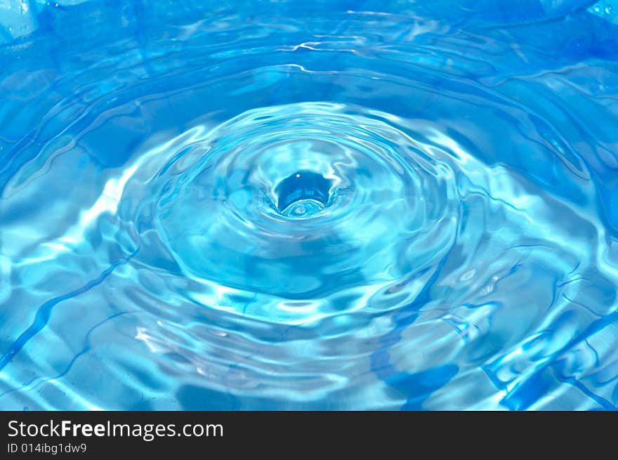 Round hole on the rippled water surface. Round hole on the rippled water surface