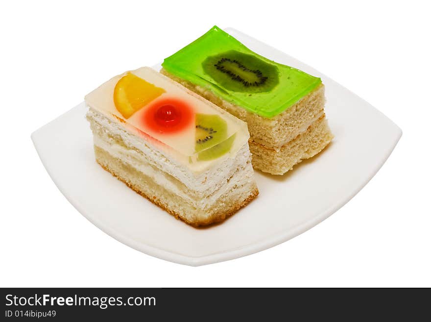 Sweet cakes with fruit on a white background