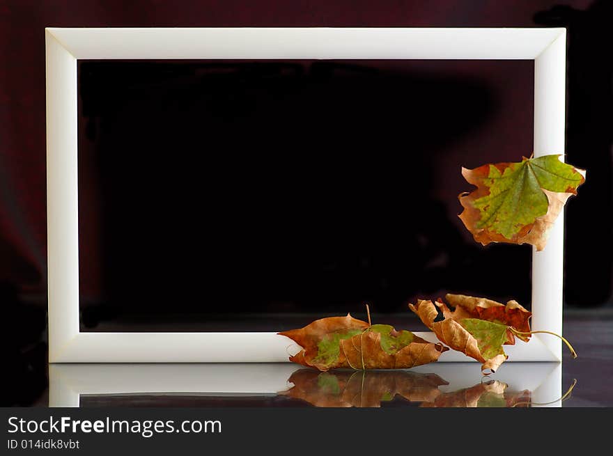 Frame with autumnal leaves against the black background. Frame with autumnal leaves against the black background