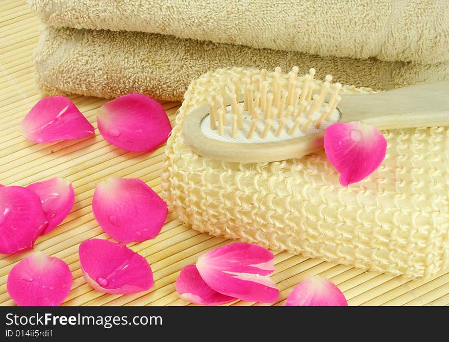 Beige terry towel and hairbrush