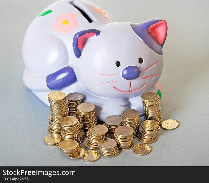 Blue cat - moneybox with columns of coins