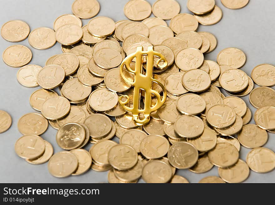 A photo of dollar sign with coins. A photo of dollar sign with coins