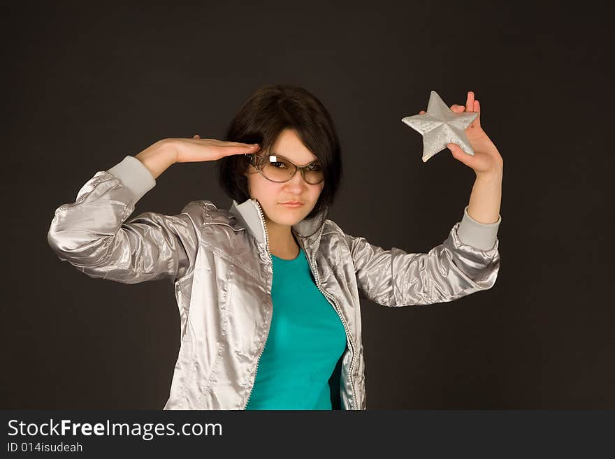 Fashion Girl In Silver Jacket Holding Star